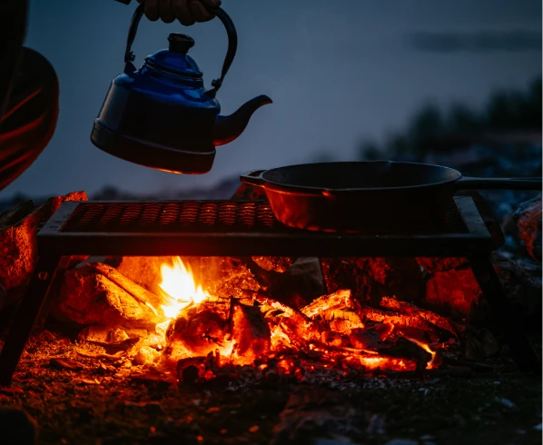 Camping kettle over open fire