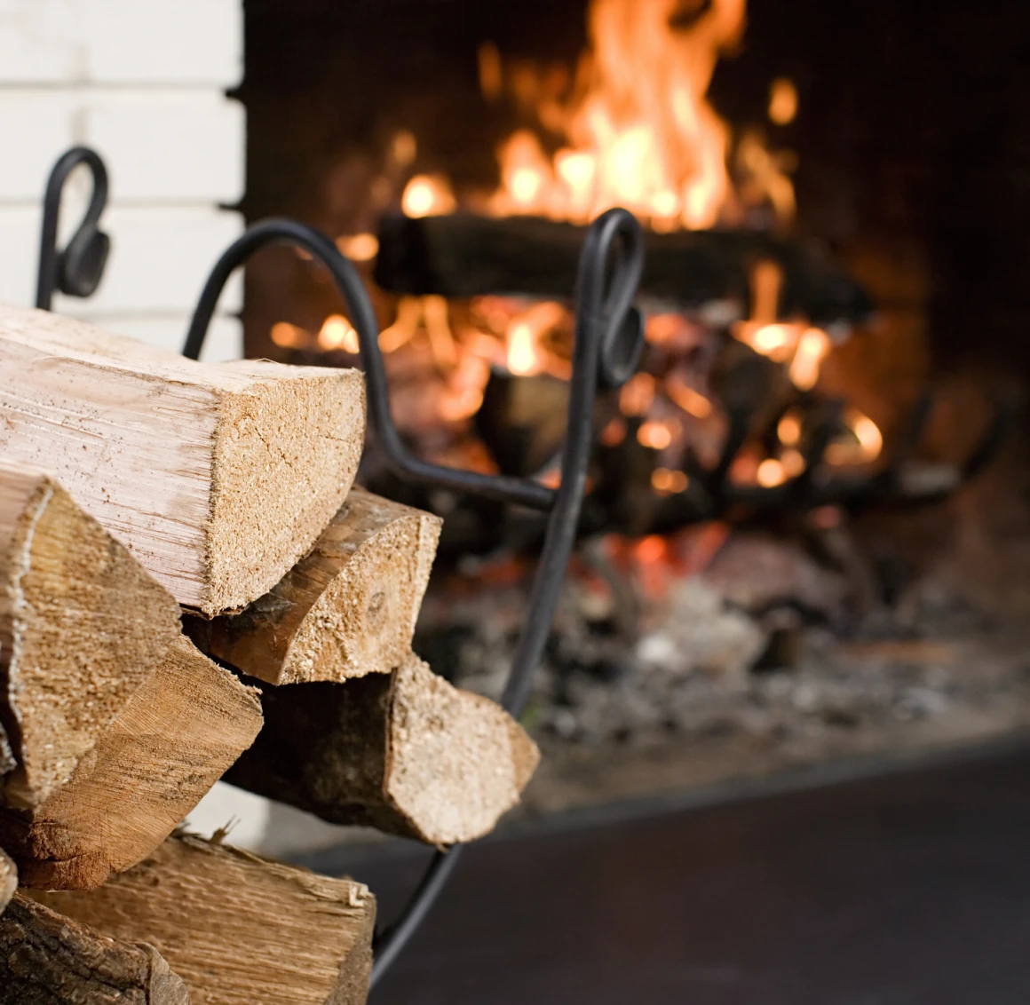 Warm fire with stacked wood logs